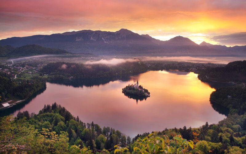 Lake Bled sunrise with island and Julian Alps